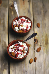 Selective focus. Macro. A bowl of cottage cheese with topping and almonds. Healthy food concept. Diet lunch or breakfast. The keto diet.