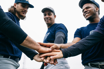 Diverse baseball team supporting each other before match