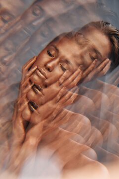 Bronzed woman with closed eyes