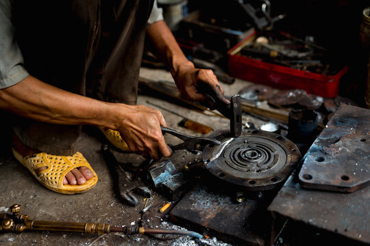 Man working in a mechanical workshop in Vietnam