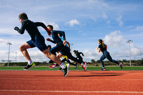 Teenagers running race on stadium