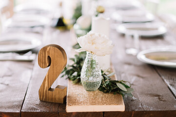 Wooden number 2 on the wedding table