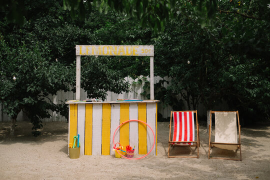 Lemonade stand and two lounge chairs