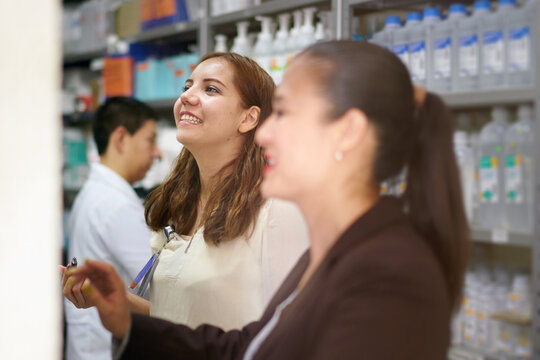 Pharmacy workers doing inventory