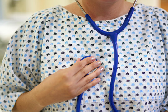 Patient checking her own heart beat