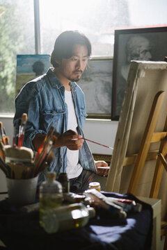 Male artist woking in studio
