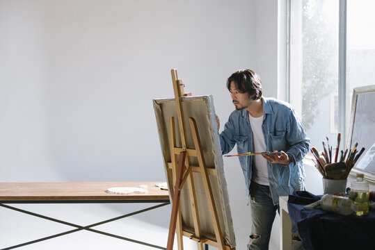 Male artist woking in studio