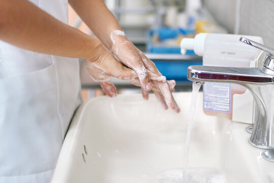 Doctor washing her hands