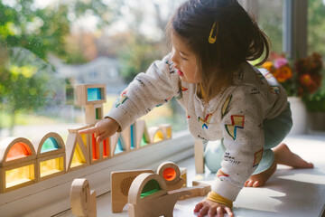 Little girl playing with blocks
