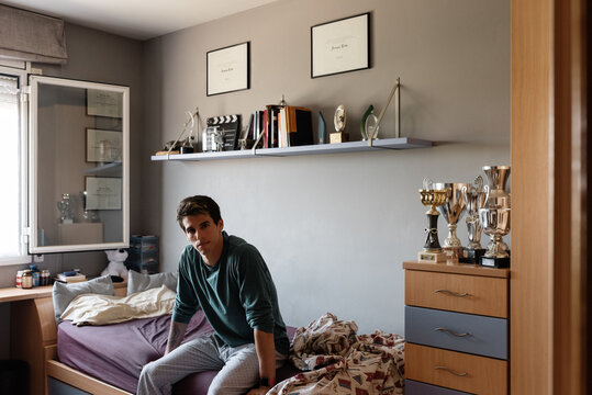 Young sportsman waking up in morning