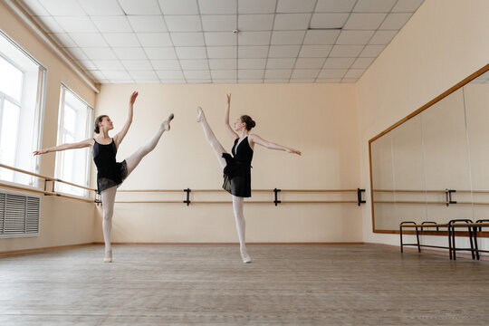 Ballerinas dancing together in studio