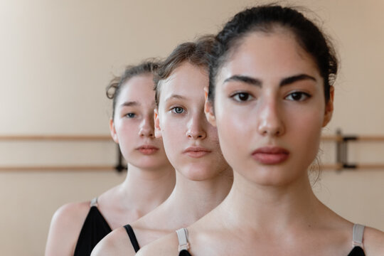 Young ballerina amidst peers during rehearsal