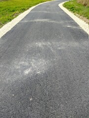 Obraz premium fresh asphalt in the field in the evening