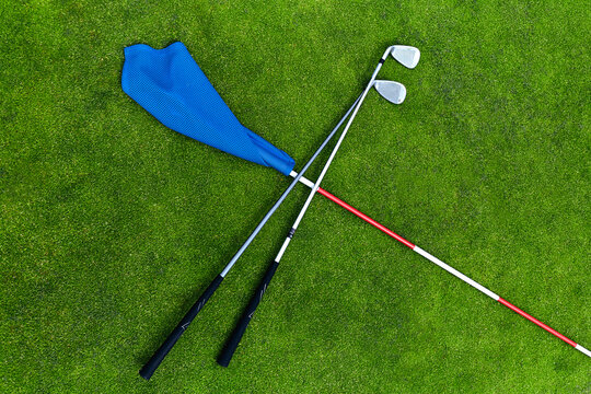 Golf club and a flag on the grass
