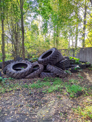 Fototapeta na wymiar polygon of old and huge tires outdoors in the autumn season