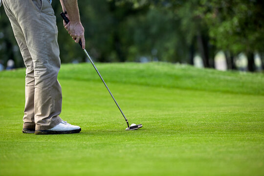 Golfer finishing his game of golf
