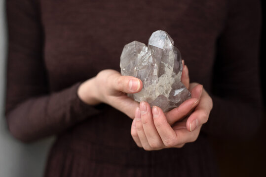Woman holding a crystal