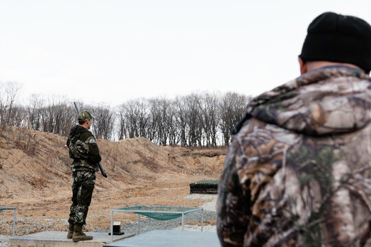 Men practicing on shooting range
