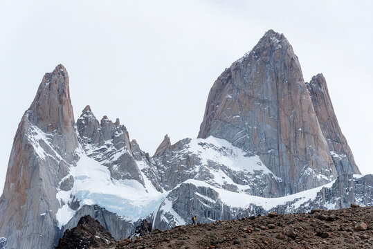 A woman hiking with walking sticks in Patagonia, Argentina