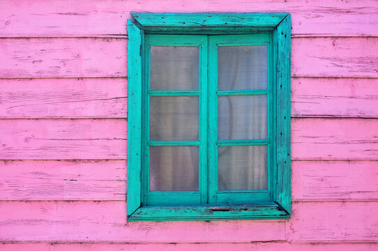 Pink and green window of a facade in Caminito street in Buenos Aires - Powered by Adobe