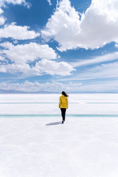 Woman walking on a salt flat