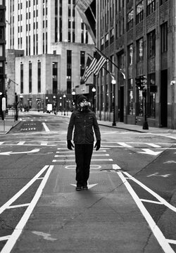 Fototapeta Man Wearing Respirator Mask Walking in Empty City