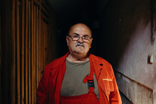 Senior handyman prepairs for work