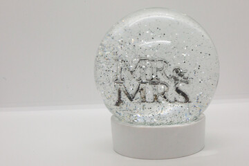 White decorative Mr and Mrs globe with a White backdrop