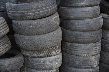 Obraz premium stack of old tires for rubber recycling 