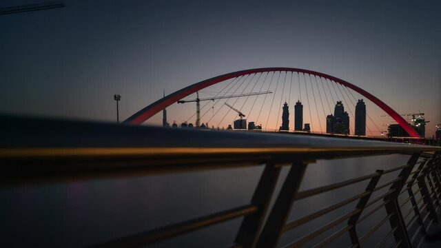 BUILDING Bridges in Dubai with reflection in water and Sunrise behind tall Buildings, AWESOME Lightning