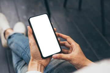 cell phone mockup blank white screen.woman hand holding texting using mobile on desk at coffee shop.background empty space for advertise.work people contact marketing business,technology