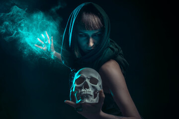 Dark sorceress casting a magic spell with a human skull