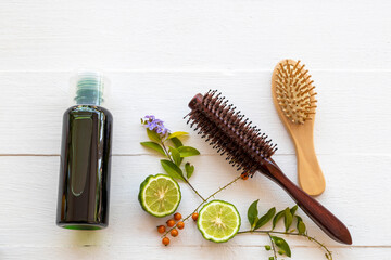 herbal shampoo extract vegetation kaffir lime flora of asia health care for  wash hairs of lifestyle cleaning with comb arrangement flat lay style on background white wooden