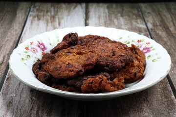 Pile of deep fried spicy fish cake, Famous traditional menu in Thai restaurant. 
