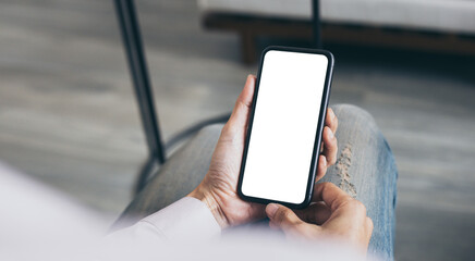 cell phone mockup blank white screen.woman hand holding texting using mobile on desk at coffee shop.background empty space for advertise.work people contact marketing business,technology .