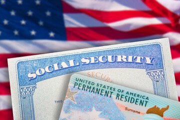 Electronic Diversity Visa Lottery DV-2022. Green Card and Social Security Card on American flag...