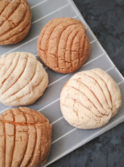 handmade traditional sweet bread shells on cooling rack.