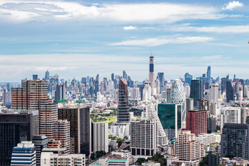 Fototapeta na wymiar Aerial view of many height buildings and condominium in Bangkok