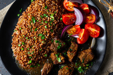 Buckwheat groats baked in the oven with beef goulash