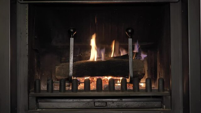 Burning Wooden Logs in Fireplace or Chiminea, Cozy Home Scene
