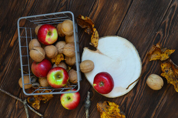 autumn healthy food decoration apples, nuts, leaves with copy space or design