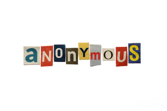 The word ANONYMOUS formed with newspaper cutout on white paper background. Letters from newspaper clippings forming the word ANONYMOUS. Concept for remaining untrackable, unidentifiable, untraceable.