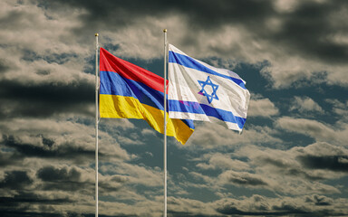 Israel and Armenian flags waving in dark sky. Symbol of relations between two countries. Armenia recalls ambassador to Israel over arms sales to Azerbaijan.