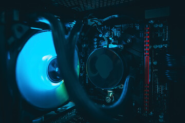 Close up shot.Computer with water cooling system.Inside of air cooled high performance modern.Blue...