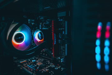 Close up shot.Computer with water cooling system.Inside of air cooled high performance modern.Blue...