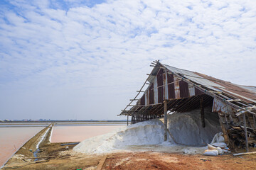 Salt storage granaries, sea salt storage in salt farms To wait for trade A sea salt barn with an indigo blue sky background.