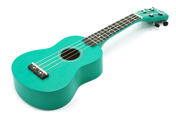 Ukulele isolated on a white background. The instrument is a small green guitar.