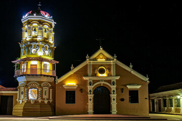 View to beautiful historic Church Santa Barbara (Iglesia de Santa Barbara) Santa Cruz de Mompox in sunlight and blue sky, World Heritage, Colombia