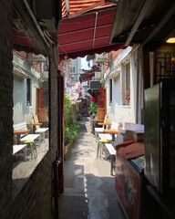 Small alley or street in historic Hutong residential living area in Shanghai or Schanghai in China