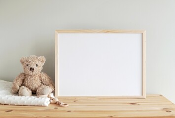 Horizontal wooden frame mockup for neutral nursery to showcase artwork, photo, print, empty frame, toy bear, wooden shelf. - obrazy, fototapety, plakaty